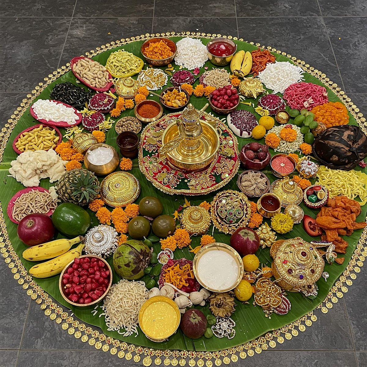The vishukkanni is a special arrangement of auspicious items such as seasonal fruits, vegetables, flowers, rice, clothes, coins, gold ornaments and more