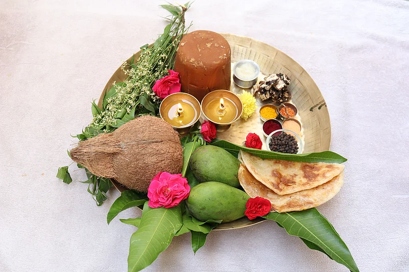 People celebrate Ugadi by preparing traditional sweets and pachadi, a sweet syrup made with raw mangoes