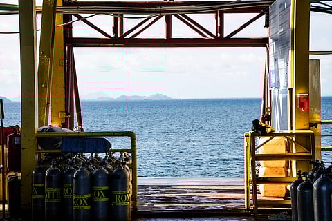 Scuba equipment next to the mechanical lift of the Seaventures Dive Rig