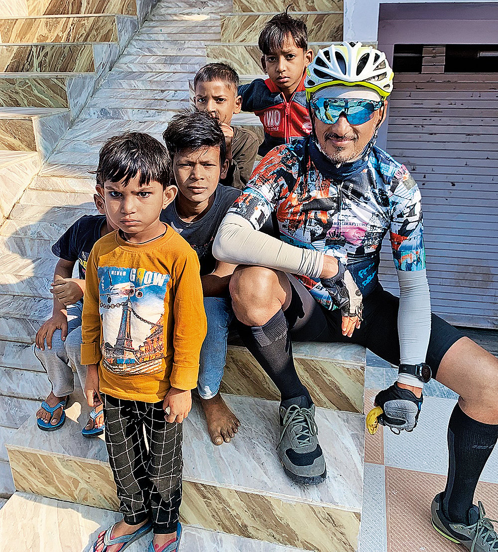 Moitra poses with kids along the way