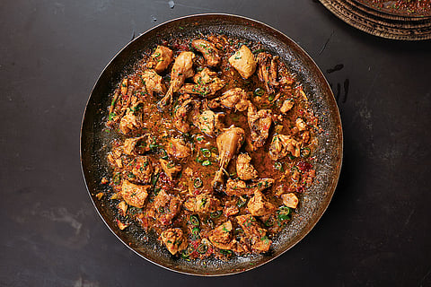 Goalondo Chicken Curry, a dish made with chicken, spices, and mustard oil