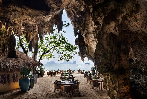 The Grotto is tucked under a limestone cliff on the stunning Phra Nang Beach in Krabi