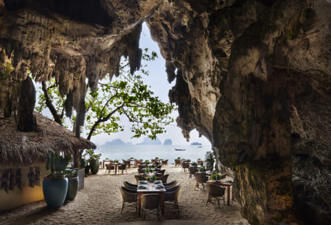 The Grotto is tucked under a limestone cliff on the stunning Phra Nang Beach in Krabi