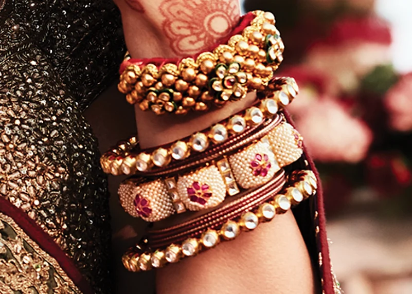 Bangdi, tussi, and hathphool are some pieces that adorn the hands of a Rajasthani bride.
