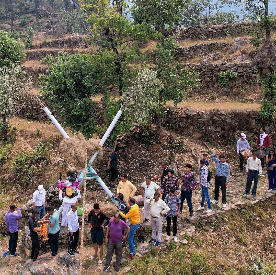 Locals making the grass rope to mark the festival