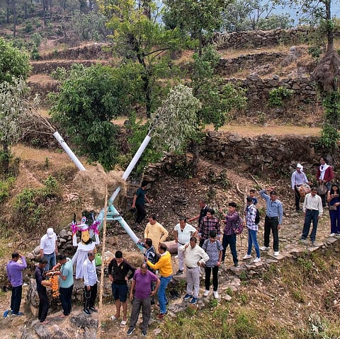 Locals making the grass rope to mark the festival