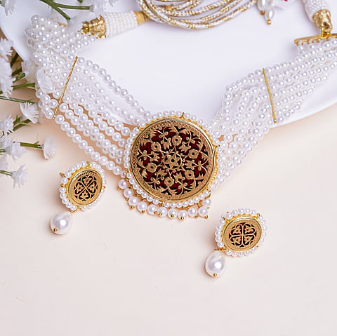 Thewa involves thin sheets of gold inscribed with meticulously punched designs. 