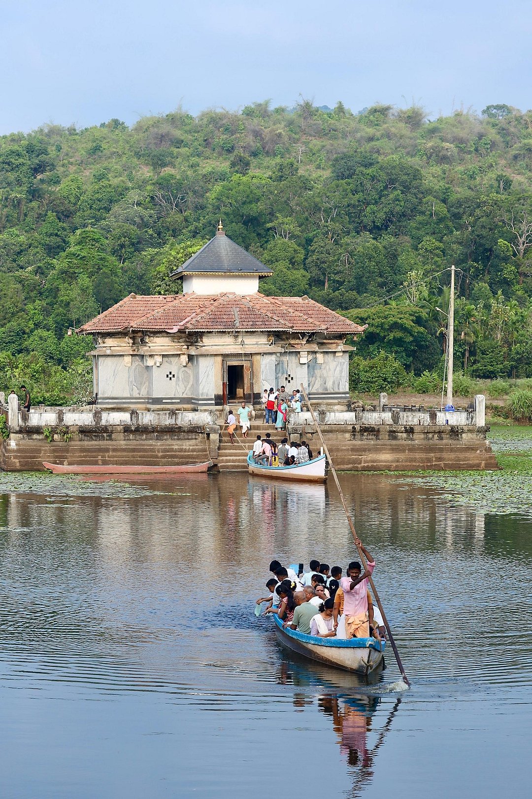 A helmsman transporting passengers from the Varanga Jain Basadi (Temple), situated in the middle of a pond