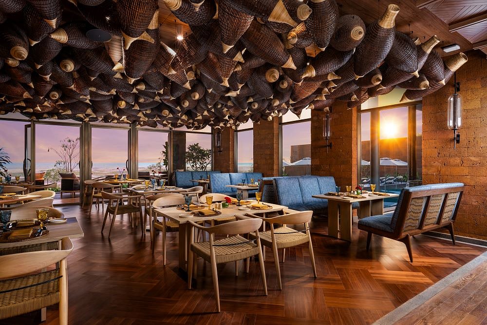 The ceiling features Vietnamese fishing nets made of bamboo