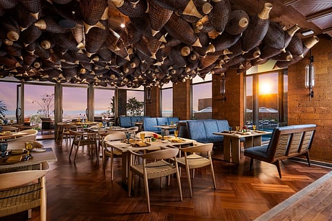 The ceiling features Vietnamese fishing nets made of bamboo