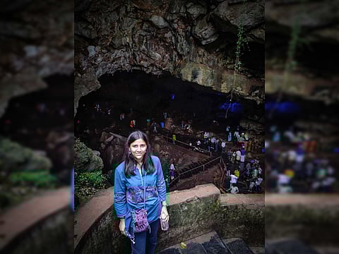 The author at the entrance of the ancient caves in Andhra Pradesh
