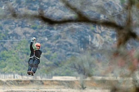 Zip line over the beautiful valley with views of forests and waterfalls