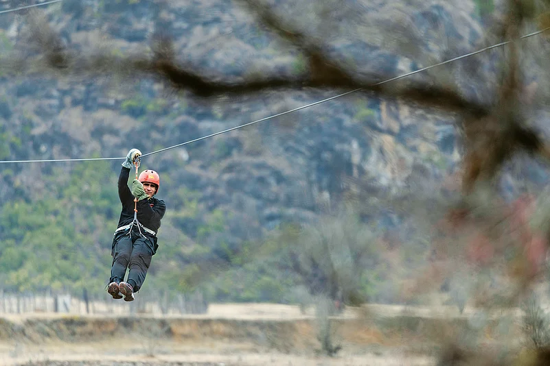 Zip line over the beautiful valley with views of forests and waterfalls