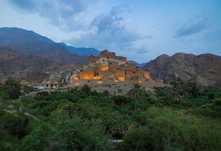 The Thee Ain Historical Village, located on the top of a rugged white mountain, can easily be seen from a distance thanks to its white glow - matts79/Shutterstock