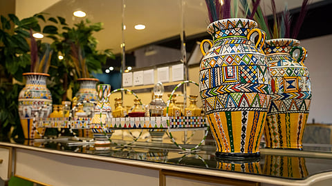 The best place to find Al-Qatt Al-Aseeri engraved products like tea and coffee cups, dishes, and stationery is in Abha