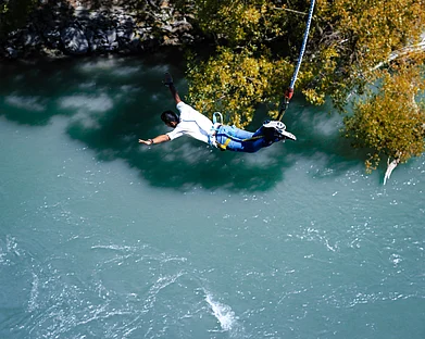 Anoof Junaid/Unsplash : Bungee jumping, also spelled bungy jumping, is an activity that involves a person jumping from a great height while connected to a large elastic cord