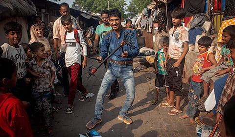 A performance goes on at Kathputli Colony