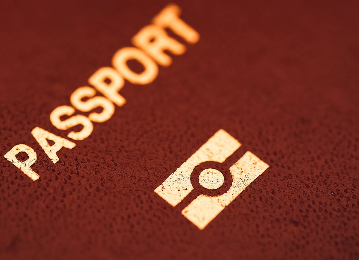 An e-passport is visually identifiable because of a gold symbol printed below the passports front cover