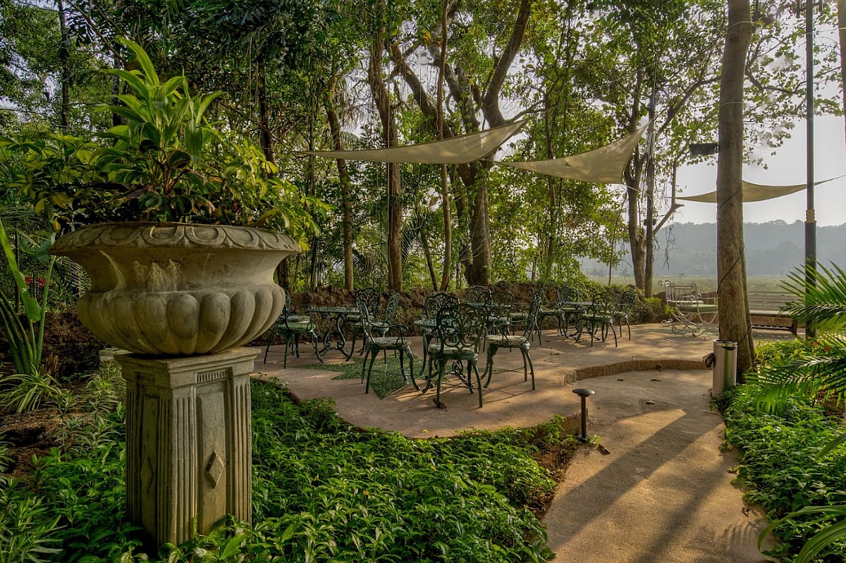 The garden has a whimsical fairycore aesthetic and overlooks paddy fields