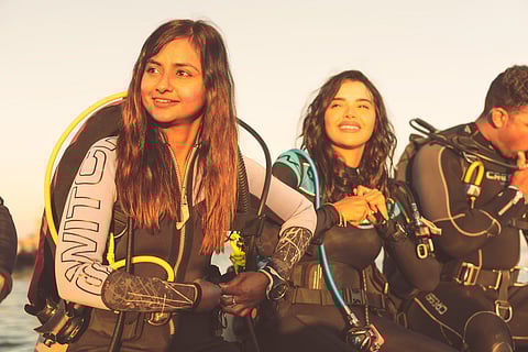 The author (left) regularly goes scuba diving in India