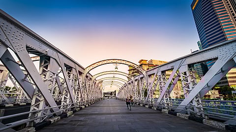 Built in 1910, the Anderson Bridge connects Merlion Park and Esplanade Park near the mouth of the Singapore River