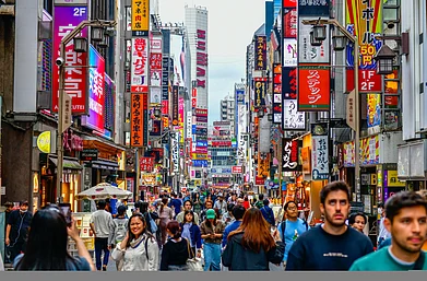 john6863373/Shutterstock : People throng Shinjuku in Tokyo