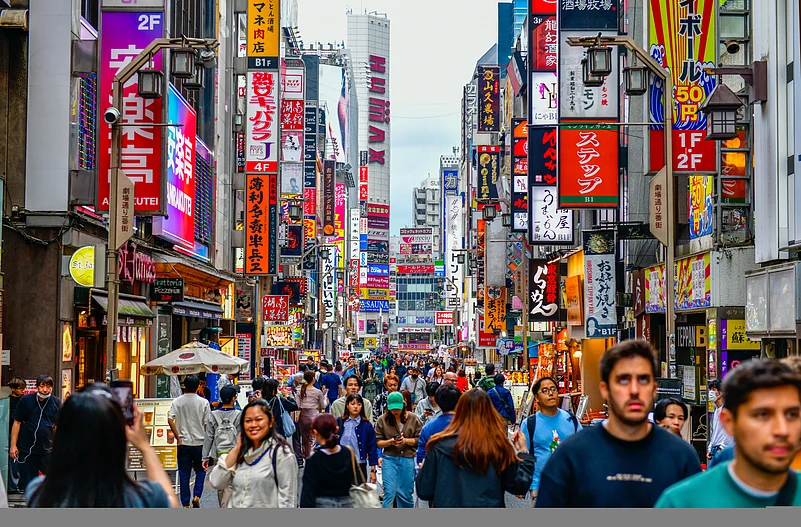 People throng Shinjuku in Tokyo