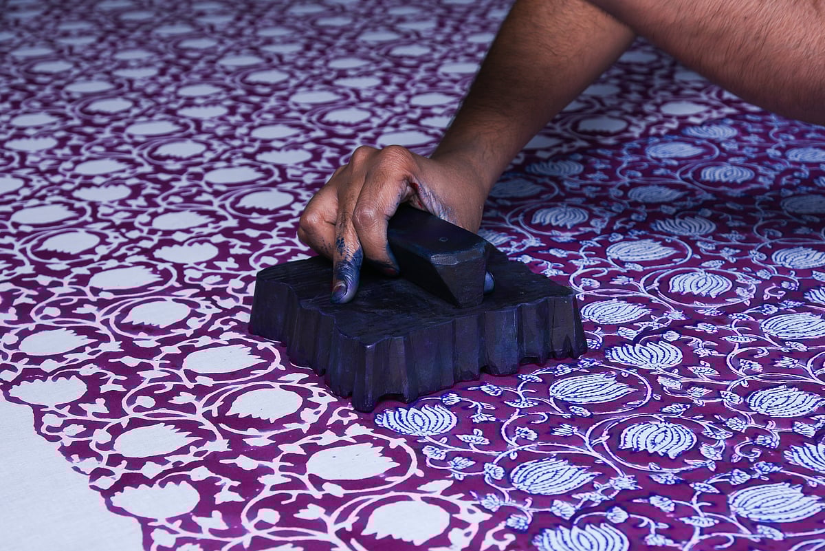 An artisan at work on hand-block printing