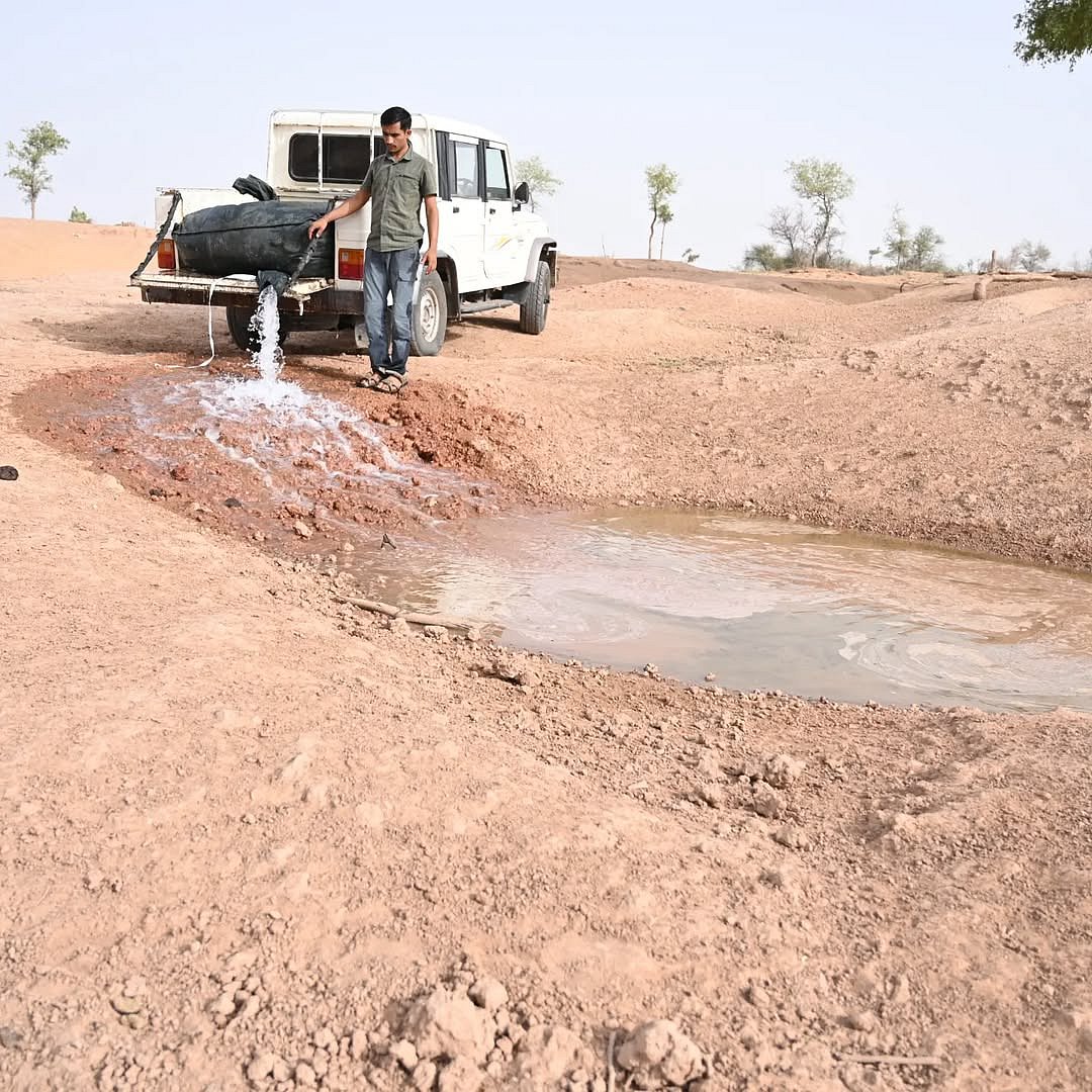 Radheshyam Bishnoi refills a water hole in Desert National Park