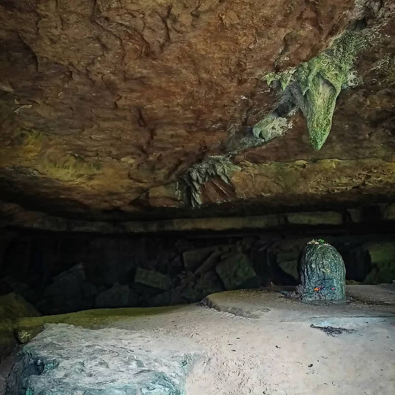 The Mawjymbuin Cave has a massive stalagmite which has been shaped by nature into a shiva lingam