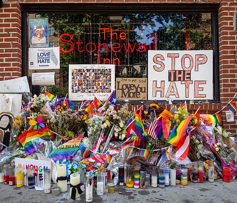 Stonewall Inn with Orlando nightclub shooting memorial during Pride 2016
