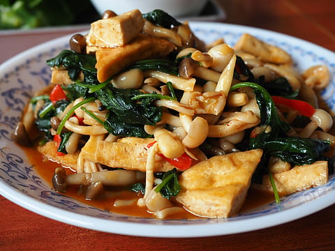 Pad gra pao het jay is made by stir-frying sliced mushrooms with garlic, chilli and Thai holy basil