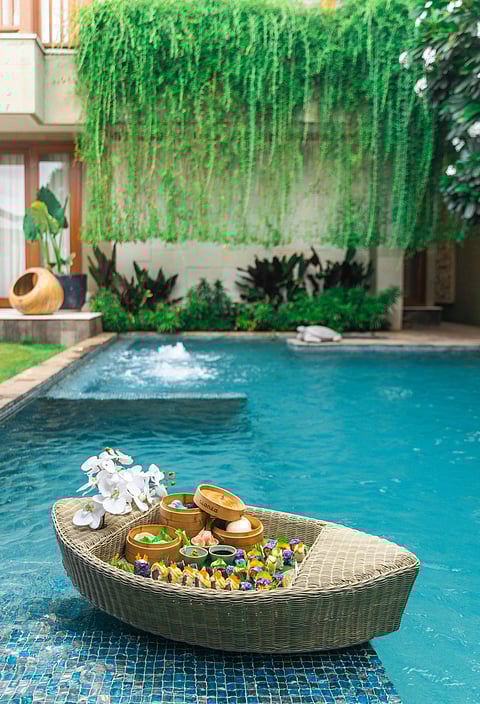 Enjoy a curated tray of indulgences served in the pool at Baale