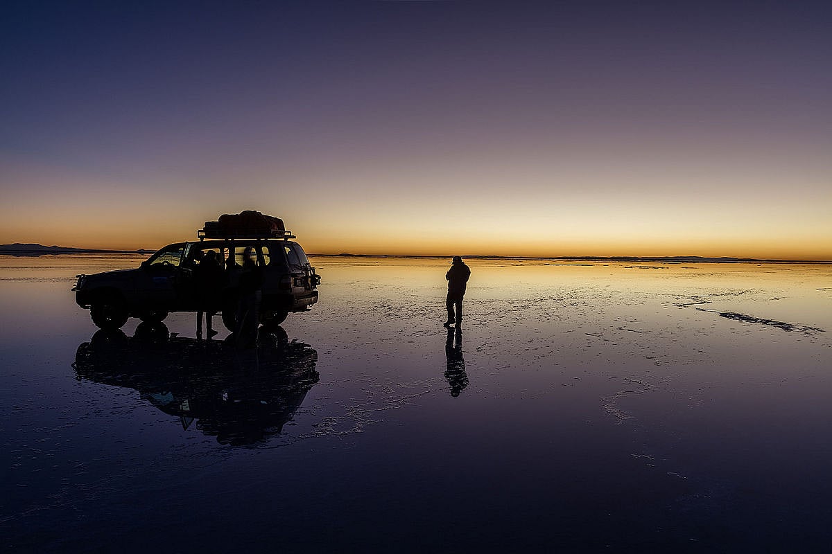 Embark on a 4WD tour to experience the expansive salt flats
