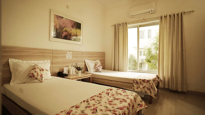 Rooms at the Vaidyaratnam Vrindavan Ayurveda Chikitsalayam come in three types: studio, standard (seen here) and premium