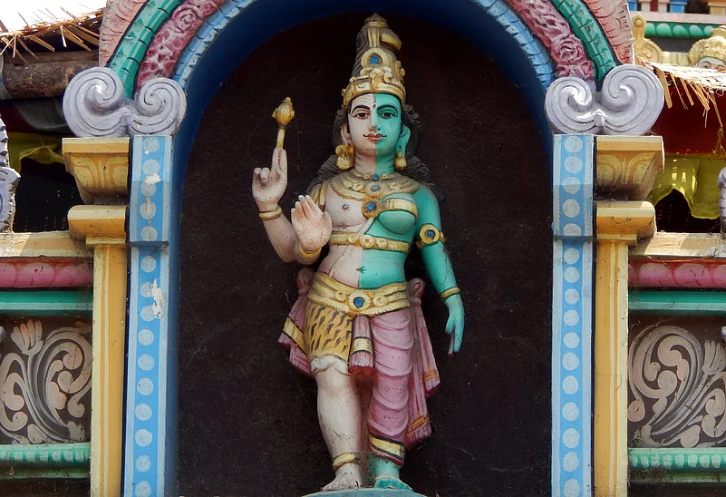 An Ardhanarishvara statue at a temple. This is the combined form of the Hindu deities Parvati and Shiva