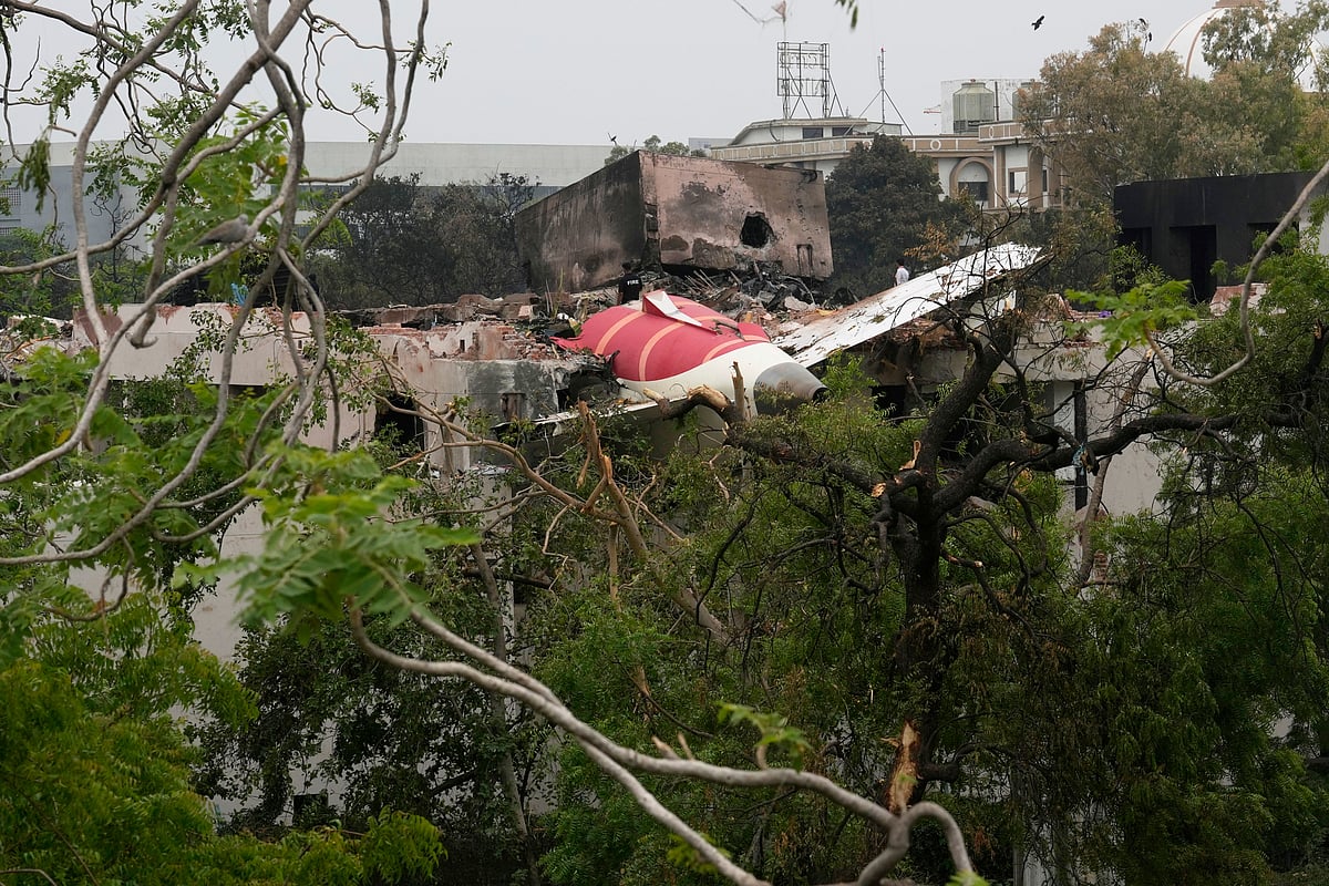 Parts of the Air India plane that crashed on Thursday seen on top of a building in Ahmedabad - AP Photo/Rafiq Maqbool