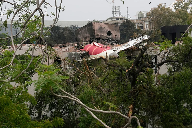 Parts of the Air India plane that crashed on Thursday seen on top of a building in Ahmedabad - AP Photo/Rafiq Maqbool