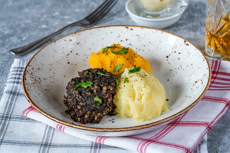 Haggis, neeps and tatties (haggis with turnips and potatoes) - Shutterstock