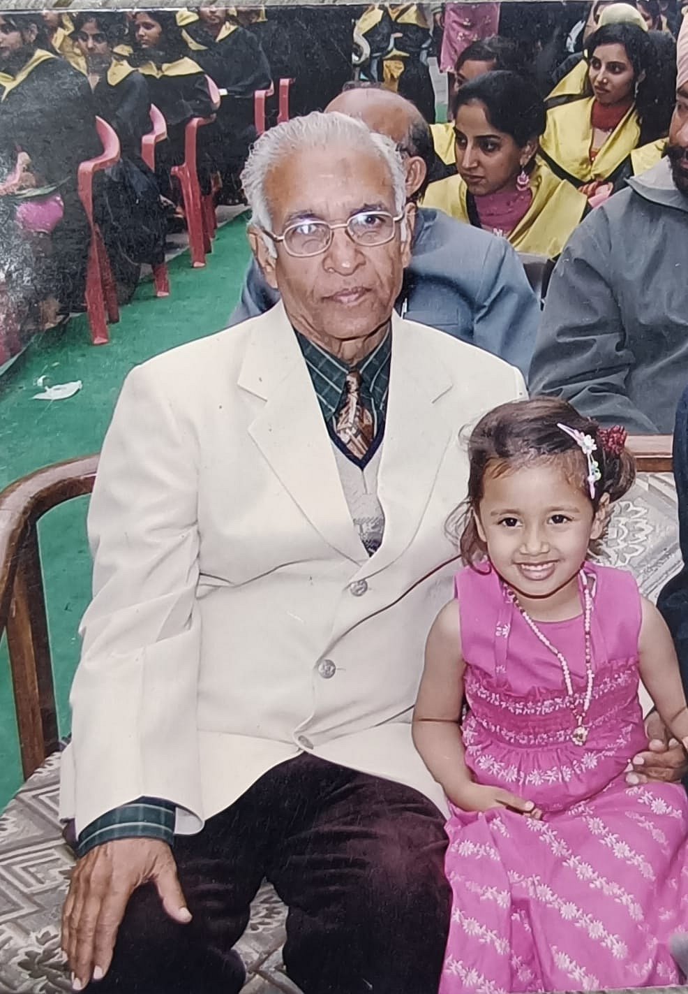 Rahat Sharma and her grandfather at a school event