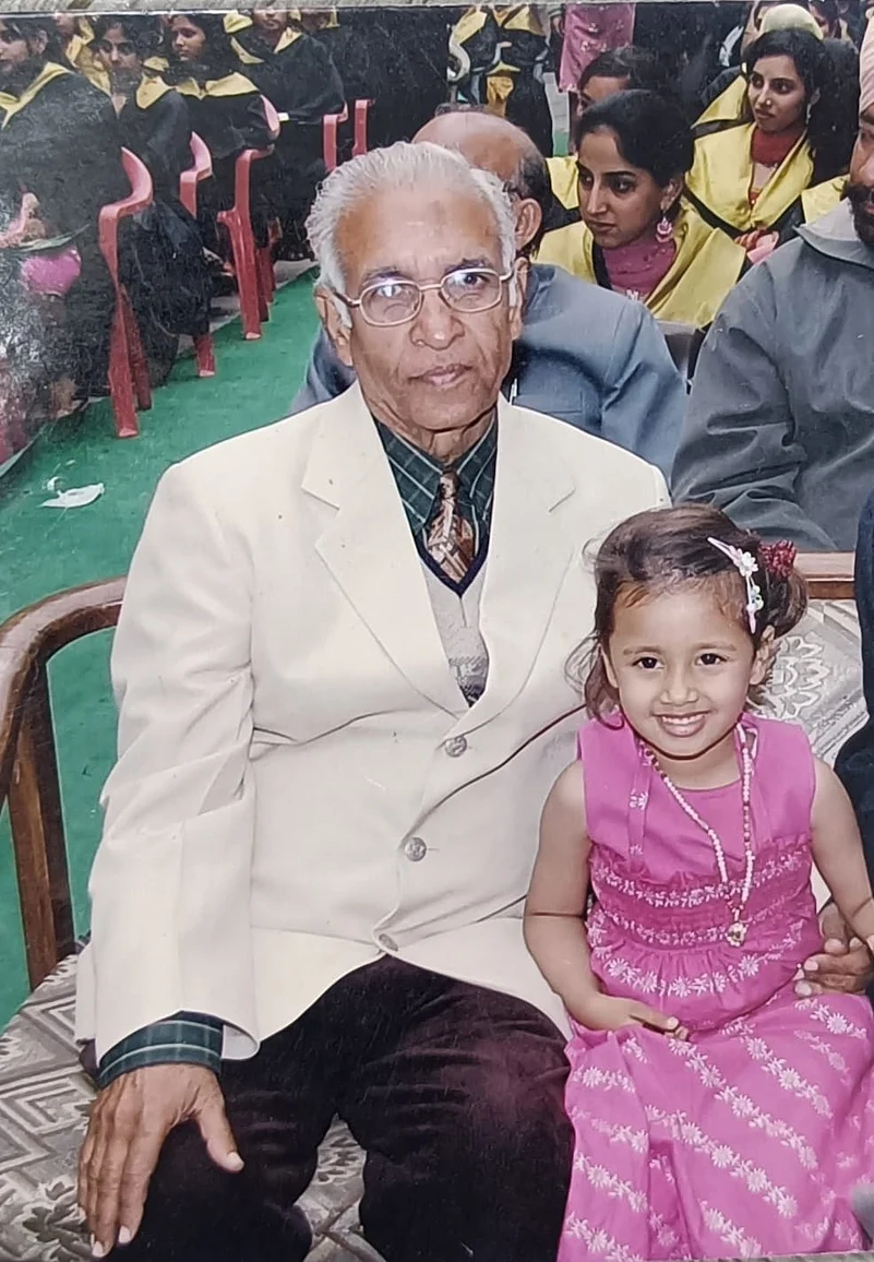 Rahat Sharma and her grandfather at a school event