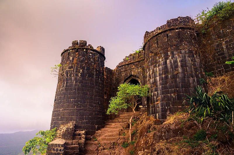 The Kalyan Darwaza of Sinhagad Fort opens towards the Konkan region