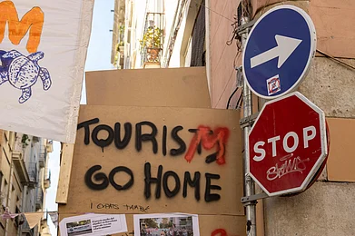 Michiko Chiba/Shutterstock : A protest sign in Barcelona, Spain
