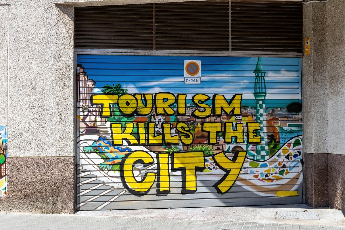 A spray painted message against overtourism in Barcelona, Spain