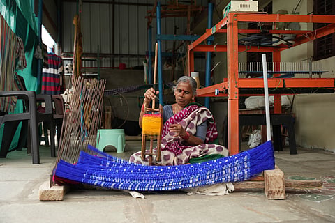 An artisan making Pochampally Ikat