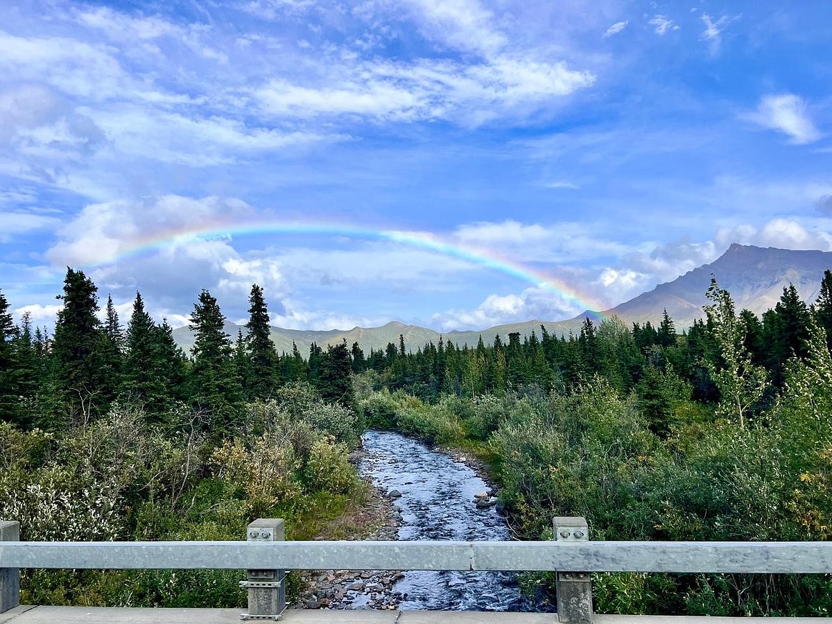 Rainbows appear on a light drizzle while on savage river hiking trail