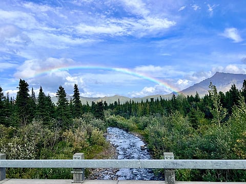 Rainbows appear on a light drizzle while on savage river hiking trail