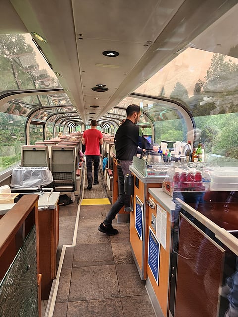 A gold star coach with panoramic view getting ready for departure from Anchorage