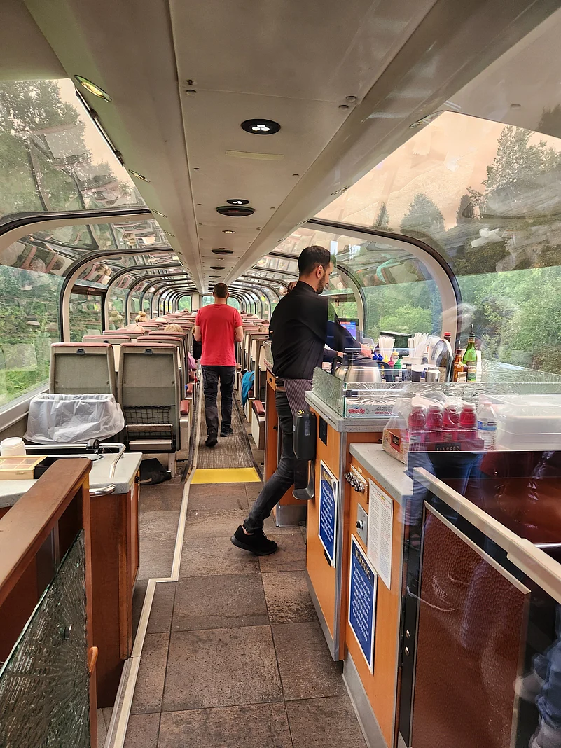 A gold star coach with panoramic view getting ready for departure from Anchorage