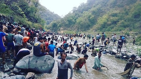 People catch fishes at the Aglar River